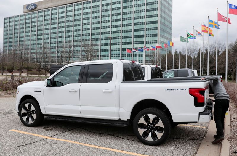 © Reuters. FILE PHOTO: A model of the all-new Ford F-150 Lightning electric pickup is parked in front of the Ford Motor Company World Headquarters in Dearborn, Michigan, U.S., April 26, 2022. REUTERS/Rebecca Cook