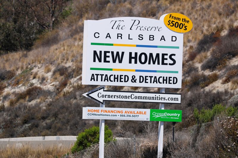 &copy; Reuters. FILE PHOTO: A sign points potential home buyers to a new development of single-family homes under construction in Carlsbad, California, California, U.S., June 25, 2018. REUTERS/Mike Blake