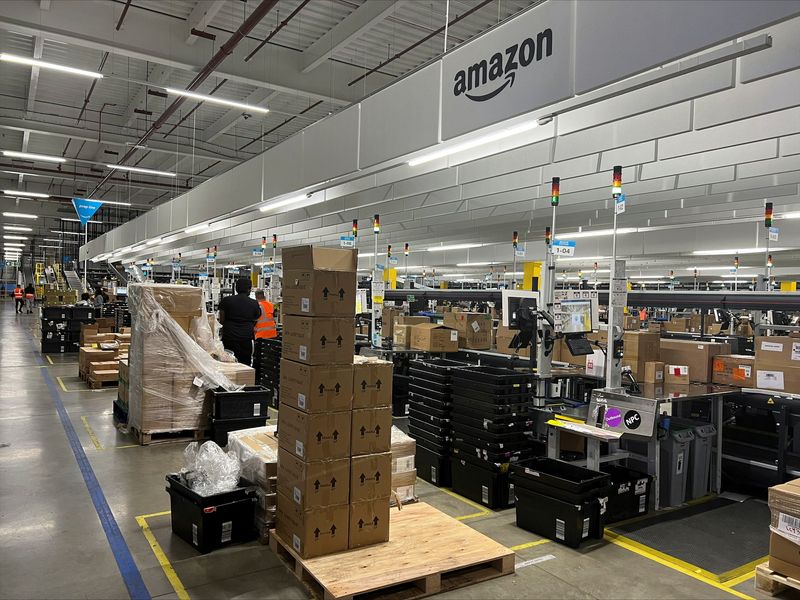 © Reuters. Boxes of products are seen waiting to be unpacked at an Amazon warehouse, which opened in August 2021, in Dartford, Kent, Britain May 3, 2023. REUTERS/Helen Reid