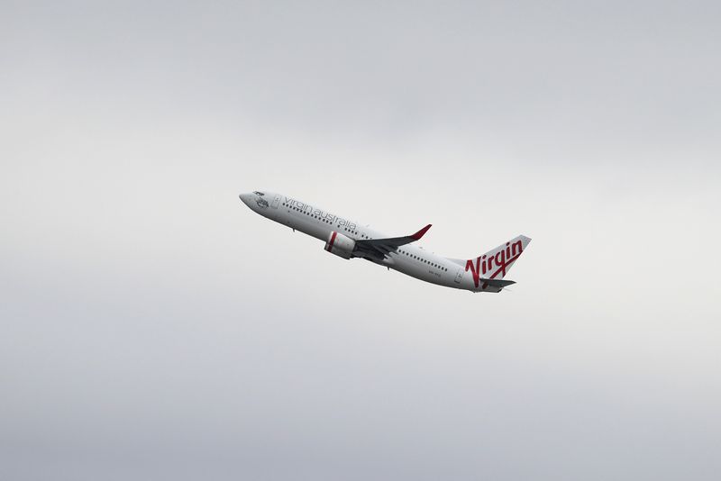 &copy; Reuters. FILE PHOTO: A Virgin Australia Airlines Boeing 737-800 plane takes off from Sydney Airport in Sydney, Australia, October 28, 2020.  REUTERS/Loren Elliott