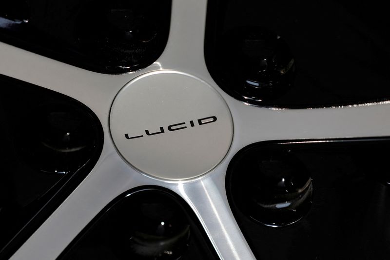 © Reuters. FILE PHOTO: A logo is seen on the wheel of a Lucid Air Dream Edition parked at the Nasdaq MarketSite as Lucid Motors (Nasdaq: LCID) began trading on the Nasdaq stock exchange after completing its business combination with Churchill Capital Corp IV in New York City, New York, U.S., July 26, 2021. REUTERS/Andrew Kelly/File Photo