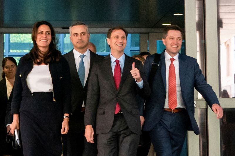 &copy; Reuters. FILE PHOTO: John Poulos, CEO of Dominion Voting Systems, and lawyers Davida Brook, Justin Nelson and Stephen Shackleford leave the courthouse after Dominion Voting Systems and Fox settled a defamation lawsuit for $787.5 million, avoiding trial, over Fox's