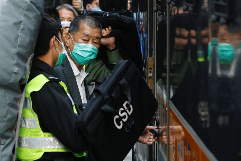 &copy; Reuters. FILE PHOTO: Media tycoon Jimmy Lai, founder of Apple Daily, looks on as he leaves the Court of Final Appeal by prison van, in Hong Kong, China February 1, 2021. REUTERS/Tyrone Siu