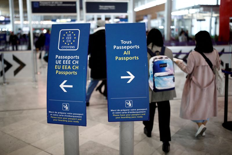 &copy; Reuters. FILE PHOTO: Directional signs for passport control are seen at Charles de Gaulle airport, operated by Aeroports de Paris, in Roissy, France, April 11, 2019. REUTERS/Benoit Tessier