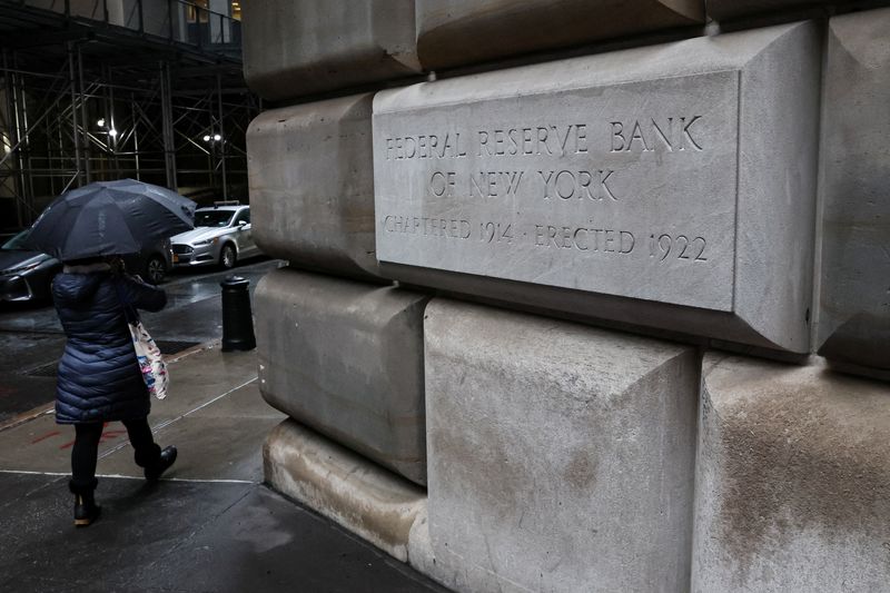 &copy; Reuters. A woman passes by The Federal Reserve Bank of New York in New York City, U.S., March 13, 2023.  REUTERS/Brendan McDermid