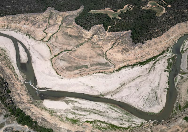 &copy; Reuters. FILE PHOTO: A view shows the ground of the Rialb reservoir as drinking water supplies have plunged to their lowest level since 1990 due to extreme drought, in the village of Bassella, Spain May 6, 2023. REUTERS/Nacho Doce/File Photo