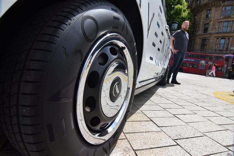 &copy; Reuters. Gunnlaugur "G" Erlendsson, CEO of UK-based tyre startup Enso, poses for a picture near the company's hybrid electric taxi fitted with tyres developed specifically for electric vehicles, in London, Britain, July 6, 2022. REUTERS/Nick Carey