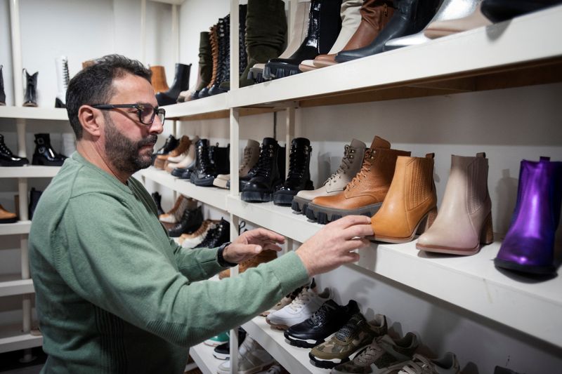 &copy; Reuters. Juan Capano, 56, sorts shoes on a shelf in his shoe making factory, as small and medium-sized businesses struggle amid rising inflation, on the outskirts of Buenos Aires, Argentina, May 4, 2023. REUTERS/Mariana Nedelcu