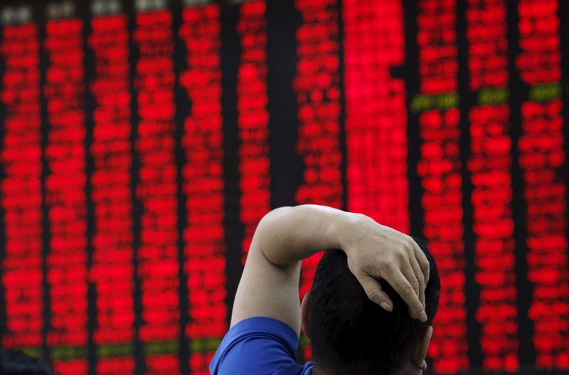 &copy; Reuters. FILE PHOTO: A man watches a board showing stock prices at a brokerage office in Beijing, China, July 1, 2015.  REUTERS/Kim Kyung-Hoon