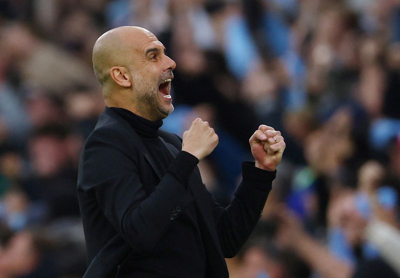 &copy; Reuters. Pep Guardiola, técnico do Manchester City, comemora o primeiro gol de seu time contra o Real Madrid
17/05/2023 
REUTERS/Molly Darlington   