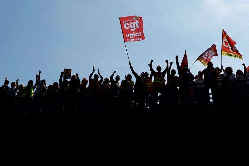 &copy; Reuters. FILE PHOTO: Protesters, holding CGT labour union flags, attend a demonstration during the ninth day of nationwide strikes and protests against French government's pension reform, in Nice, France, March 23, 2023. REUTERS/Eric Gaillard/File Photo