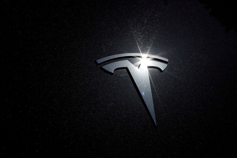 &copy; Reuters. FILE PHOTO: The Tesla logo is seen on a car in Los Angeles, California, U.S., July 9, 2020. REUTERS/Lucy Nicholson