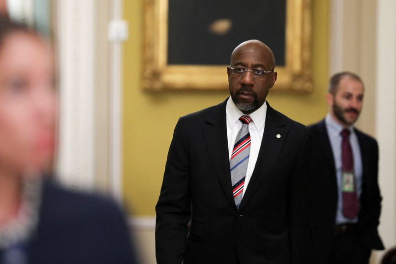 &copy; Reuters. FILE PHOTO: U.S. Senator Raphael Warnock (D-GA) walks through the hall of the U.S. Capitol in Washington, U.S., April 18, 2023. REUTERS/Amanda Andrade-Rhoades/File Photo