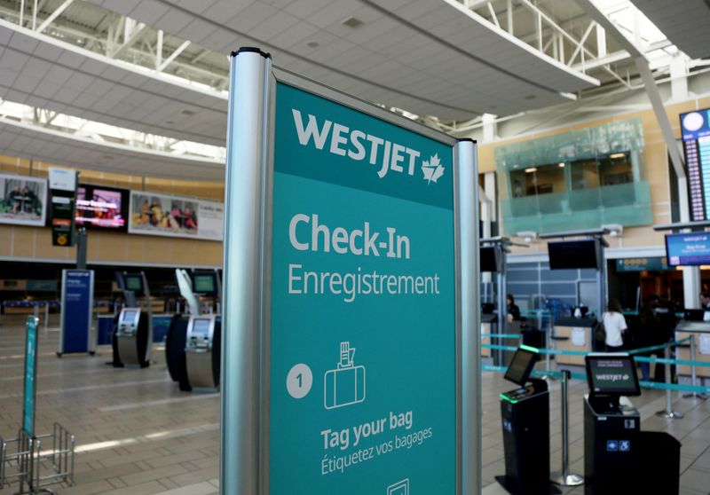 &copy; Reuters. FILE PHOTO: WestJet airline signage is pictured at Vancouver's international airport in Richmond, British Columbia, Canada, February 5, 2019.  REUTERS/Ben Nelms/