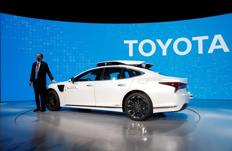 © Reuters. FILE PHOTO: Gill Pratt, CEO of the Toyota Research Institute (TRI), poses by a research vehicle equipped with Toyota Guardian, a accident avoidance system that assists drivers, during a Toyota news conference at the 2019 CES in Las Vegas, Nevada, U.S. January 7, 2019. REUTERS/Steve Marcus/File Photo