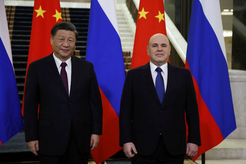 &copy; Reuters. رئيس الوزراء الروسي ميخائيل ميشوستين و الرئيس الصيني شي جين بينغ خلال اجتماع في موسكو يوم 21 مارس آذار 2023. صورة لرويترز من ممثل لوكالات الأنب