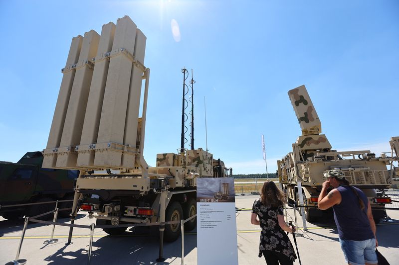 &copy; Reuters. FILE PHOTO: Visitors take a look at the IRIS-T SLM, a German air defence system by Diehl, displayed at the ILA Berlin Air Show 2022 in Berlin, Germany June 22, 2022. REUTERS/Fabrizio Bensch