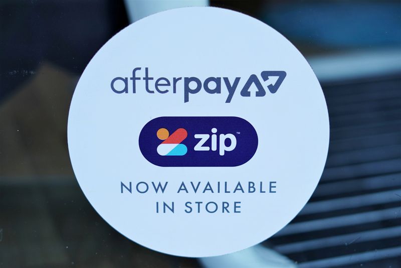 &copy; Reuters. FILE PHOTO: A logo for the companies Afterpay and Zip is seen in a store window in Sydney, Australia, July 9, 2020.  REUTERS/Stephen Coates/File Photo