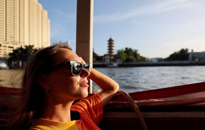 © Reuters. A screen grab shows Lillian Smith, 30, from Mississippi, U.S., during a city tour at Wat Arun temple in Bangkok, Thailand May 13, 2023. REUTERS/Jorge Silva