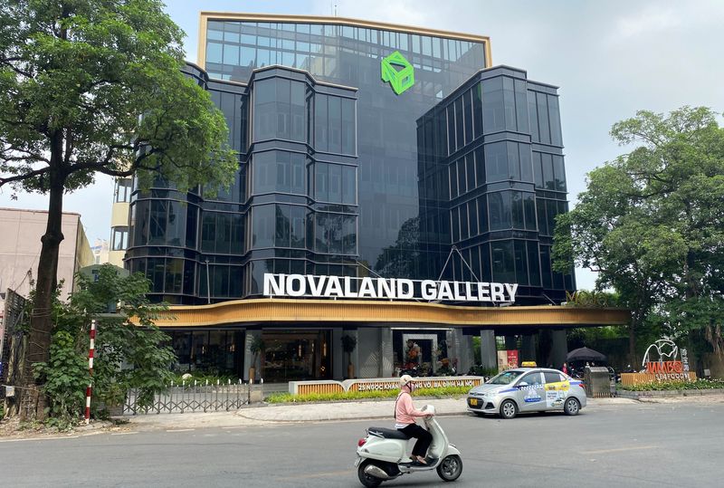 &copy; Reuters. A motorbike drives past Vietnam's property giant No Va Land gallery in Hanoi, Vietnam May 23, 2023. REUTERS/Francesco Guarascio