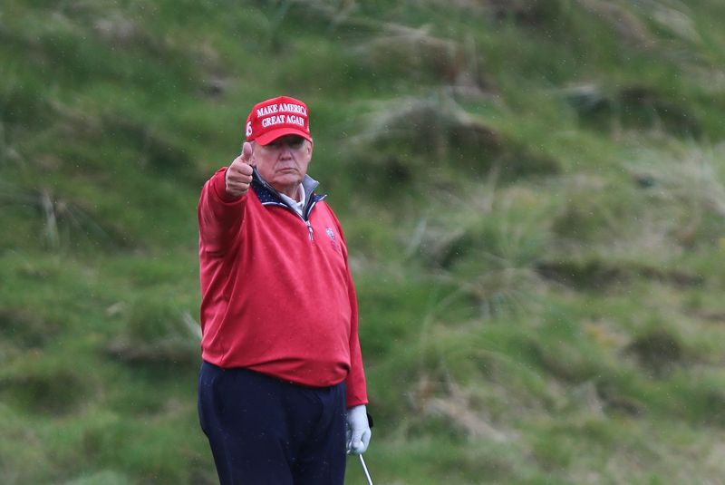 &copy; Reuters. Former U.S. President and Republican presidential candidate Donald Trump gestures as he plays golf at Trump International Golf Links course, in Doonbeg, Ireland May 4, 2023. REUTERS/Damien Storan/File Photo