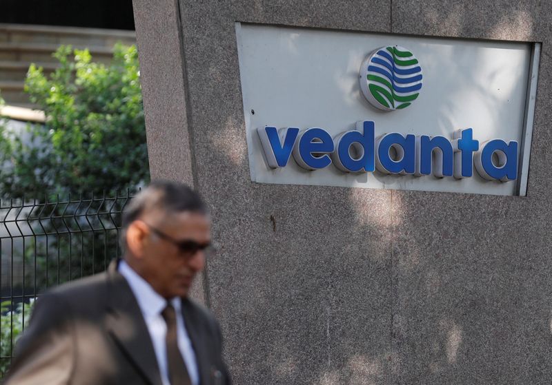 &copy; Reuters. FILE PHOTO: A man walks past the logo of Vedanta outside its headquarters in Mumbai, India January 31, 2018. REUTERS/Danish Siddiqui/File Photo