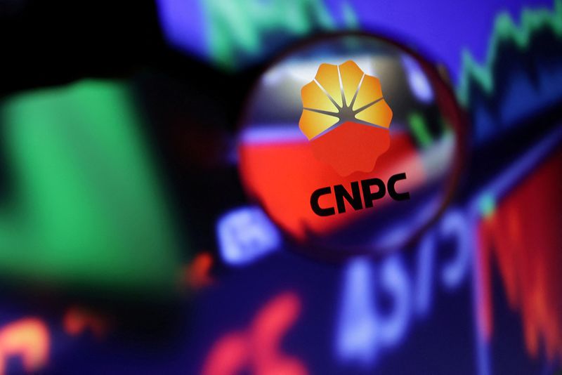 © Reuters. FILE PHOTO: CNPC (China National Petroleum Corporation) logo and stock graph are seen through magnifier displayed in this illustration taken September 4, 2022. REUTERS/Dado Ruvic/Illustration/File Photo