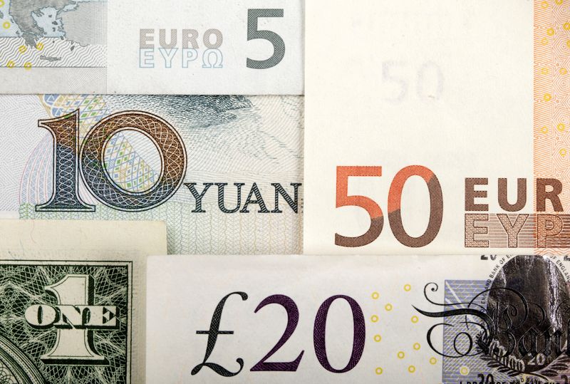 &copy; Reuters. FILE PHOTO: Arrangement of various world currencies including Chinese Yuan, US Dollar, Euro, British Pound, shot January 25, 2011.  REUTERS/Kacper Pempel/Illustration/File Photo