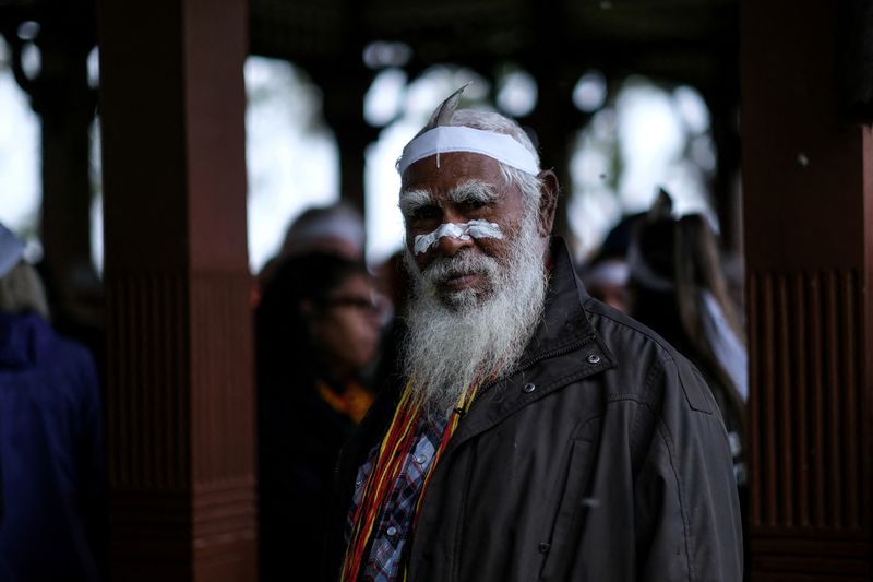 © Reuters. FILE PHOTO: Aboriginal group member looks on during a protest against what the groups say is a lack of detail and consultation on new heritage protection laws, after the Rio Tinto mining group destroyed ancient rock shelters for an iron ore mine last year, in Perth, Australia August 19, 2021. Courtesy Gabrielle Timmins/Kimberley Land Council/Handout via REUTERS 