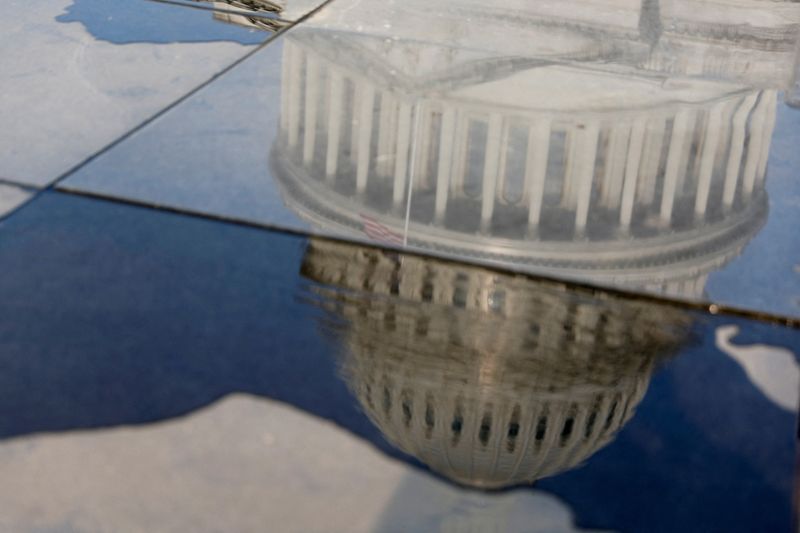 &copy; Reuters. The U.S. Capitol is reflected in a dwindling puddle in the midst of ongoing negotiations seeking a deal to raise the United States' debt ceiling and avoid a catastrophic default, in Washington, U.S. May 24, 2023.  REUTERS/Jonathan Ernst