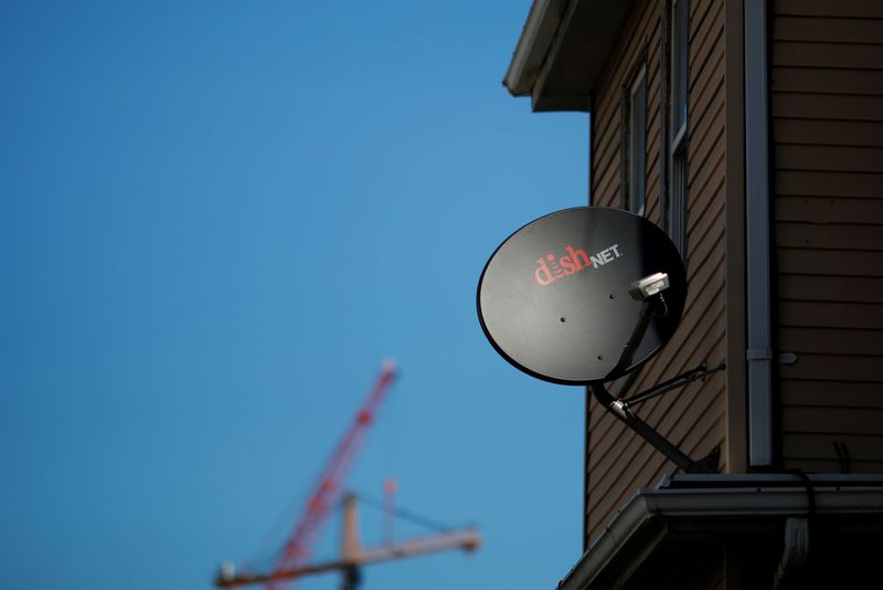 &copy; Reuters. FILE PHOTO: A Dish Network receiver hangs on a house in Somerville, Massachusetts, U.S., February 21, 2017. REUTERS/Brian Snyder