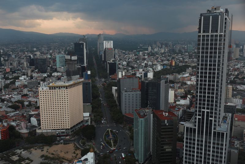 &copy; Reuters. A view of Mexico city's skyline during a sunset as cars are pictured along Reforma Avenue in Mexico City, Mexico in this picture taken through glass in a building, May 24, 2023. REUTERS/Henry Romero