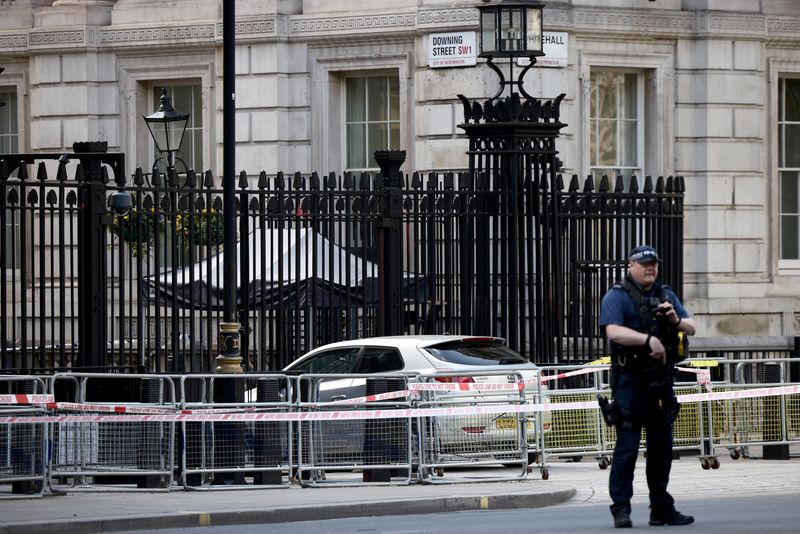 &copy; Reuters. FILE PHOTO: A police officer works at the site where a car crashed into the front gates of Downing Street in London, Britain, May 25, 2023. REUTERS/Henry Nicholls