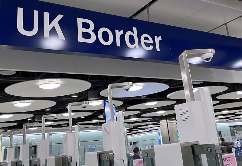 &copy; Reuters. FILE PHOTO: A sign is seen at the arrivals passport control area of Terminal 5, at Heathrow Airport, London, Britain, March 23, 2023. REUTERS/Toby Melville