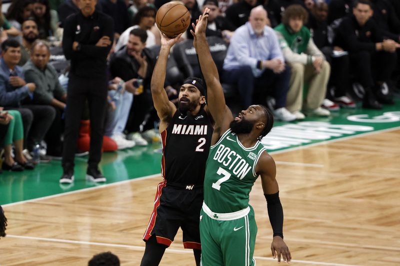 © Reuters. May 29, 2023; Boston, Massachusetts, USA; Miami Heat guard Gabe Vincent (2) shoots against Boston Celtics guard Jaylen Brown (7) during the third quarter of game seven of the Eastern Conference Finals for the 2023 NBA playoffs at TD Garden. Mandatory Credit: Winslow Townson-USA TODAY Sports