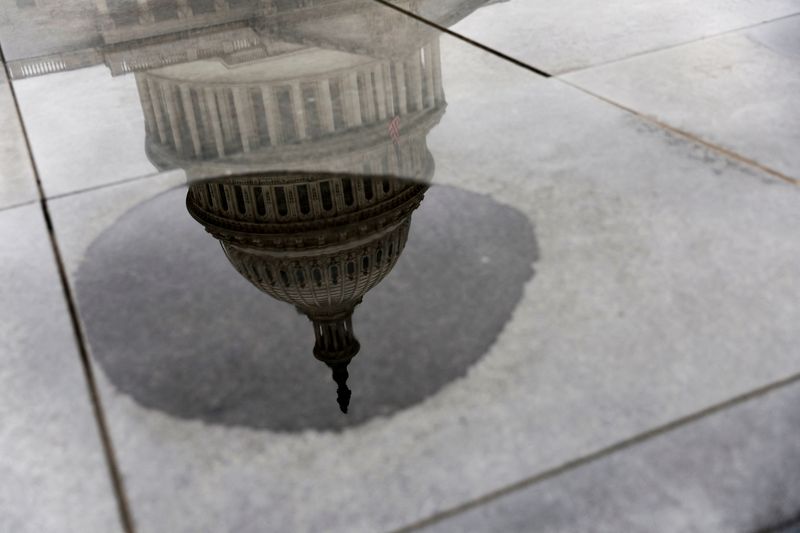 &copy; Reuters. The U.S. Capitol's dome is reflected in a puddle, in the midst of an ongoing legislative effort to raise the United States' debt ceiling and avoid a catastrophic default, in Washington, U.S. May 30, 2023.  REUTERS/Jonathan Ernst