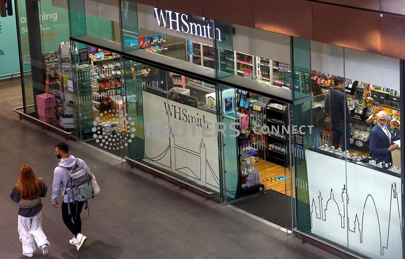 &copy; Reuters. FILE PHOTO: People walk past a WH Smith store in London, Britain, April 16 2023.  REUTERS/Peter Nicholls