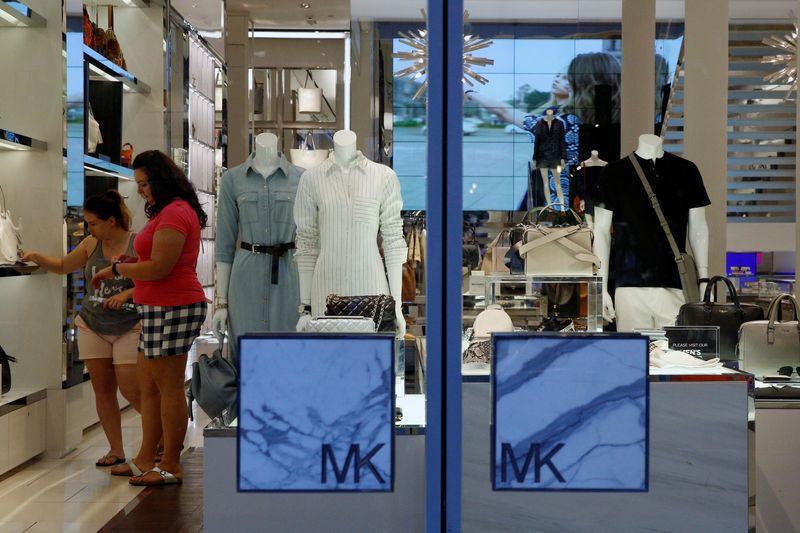 &copy; Reuters. FILE PHOTO: People shop in the Michael Kors store in the SoHo section of New York City, U.S. May 31, 2016.  REUTERS/Brendan McDermid
