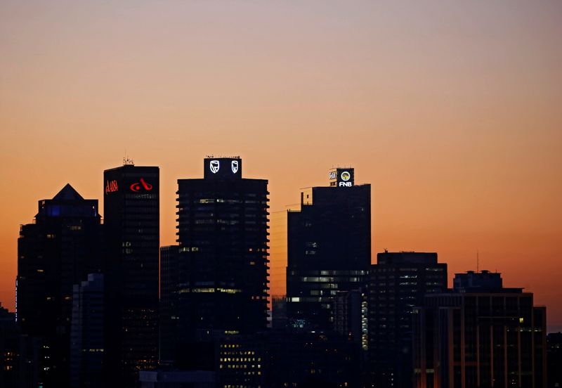 &copy; Reuters. FILE PHOTO: The buildings with the logos of three of South Africa's biggest banks, ABSA, Standard Bank and First National Bank (FNB) are seen against the city skyline in Cape Town, South Africa, September 3, 2017. REUTERS/Mike Hutchings