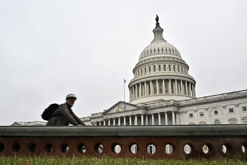 &copy; Reuters. FILE PHOTO: A cyclist passes by the U.S. Capitol building, on the morning of the first day of the 118th Congress in Washington, DC, U.S., January 3, 2023. REUTERS/Jon Cherry