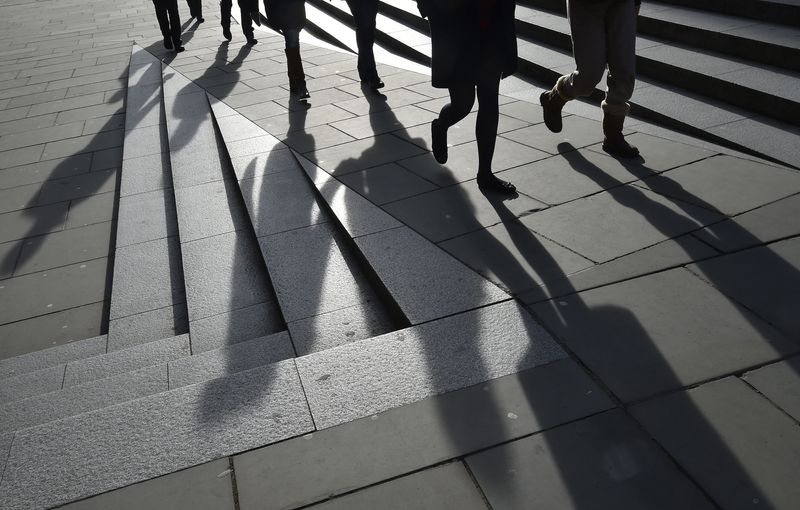 &copy; Reuters. FILE PHOTO: Workers are seen walking during the lunch hour in the City of London, in Britain, January 21, 2016. REUTERS/Toby Melville
