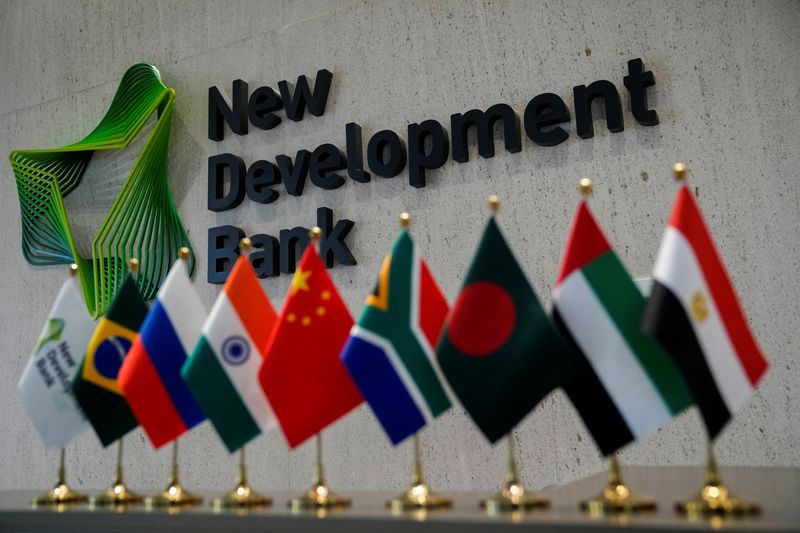 &copy; Reuters. FILE PHOTO: A sign of the New Development Bank (NDB) of BRICS countries is pictured at its headquarters in Shanghai, China, May 30, 2023. REUTERS/Aly Song