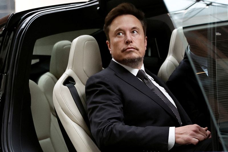 &copy; Reuters. Tesla Chief Executive Officer Elon Musk gets in a Tesla car as he leaves a hotel in Beijing, China May 31, 2023. REUTERS/Tingshu Wang