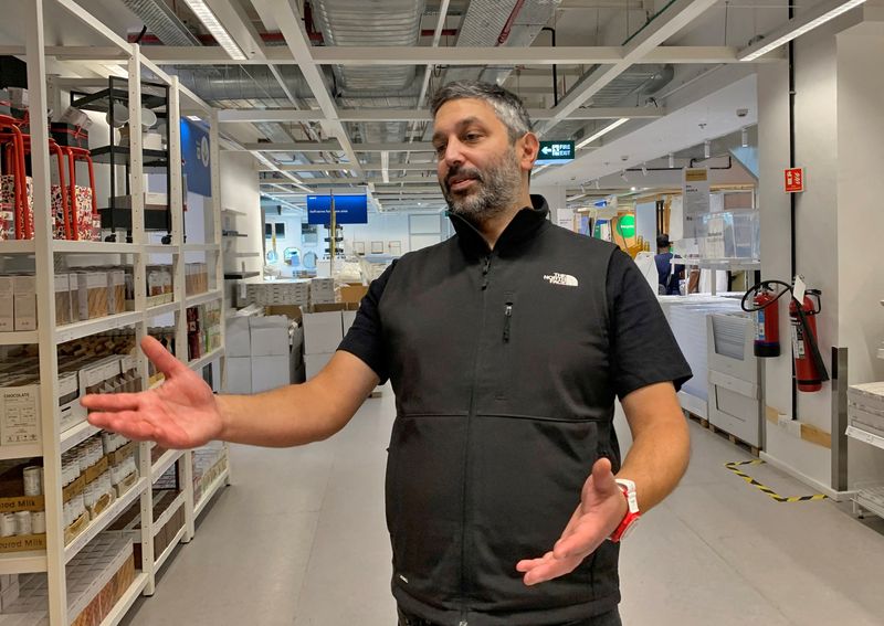 © Reuters. FILE PHOTO: Tolga Oncu, head of retail at Ingka group which owns most IKEA stores worldwide, speaks with his staff after his interview with Reuters inside an IKEA store in Mumbai, India, November 28, 2022. REUTERS/Abhirup Roy/File Photo