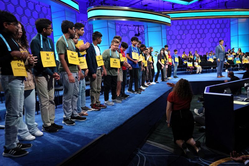 &copy; Reuters. FILE PHOTO: Competitors are adjusted by a person who is off camera as they celebrate moving to the semifinals of the Scripps National Spelling Bee competition in National Harbor, Maryland U.S., May 31, 2023. REUTERS/Leah Millis/File Photo