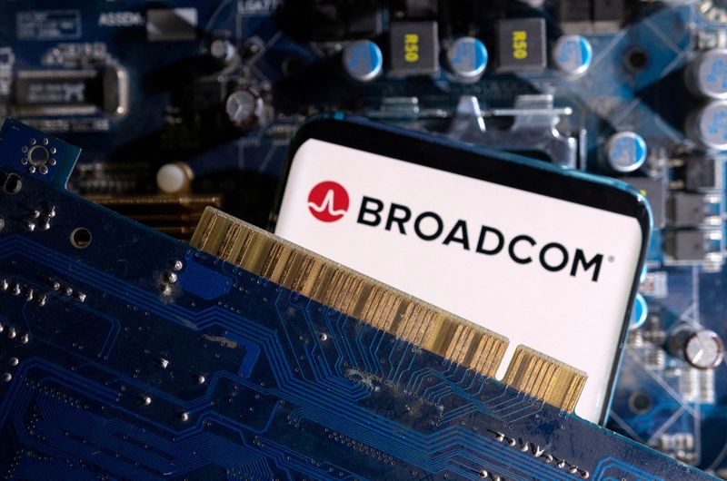 &copy; Reuters. FILE PHOTO: A smartphone with a displayed Broadcom logo is placed on a computer motherboard in this illustration taken March 6, 2023. REUTERS/Dado Ruvic/Illustration