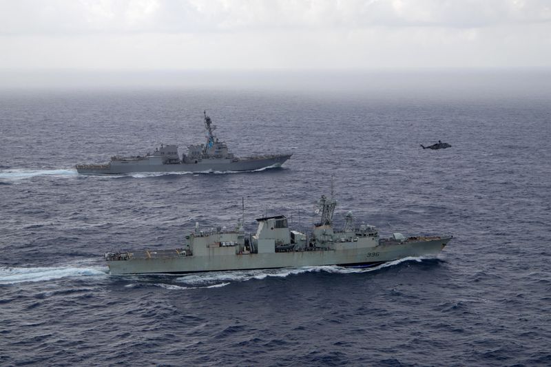 &copy; Reuters. FILE PHOTO: U.S. Navy guided-missile destroyer USS Chung-Hoon sails alongside the Royal Canadian Navy frigate HMCS Montreal during Surface Action Group operations as a part of exercise “Noble Wolverine" in the South China Sea May 30, 2023.  U.S. Navy/Na