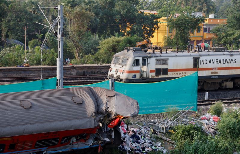 Trains cross site of Indian rail disaster as services resume