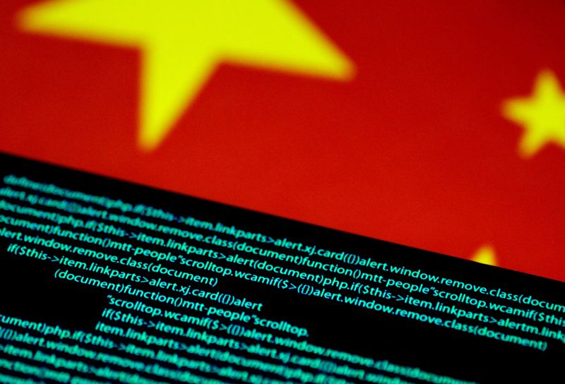 &copy; Reuters. FILE PHOTO: Computer code is seen on a screen above a Chinese flag in this July 12, 2017 illustration photo.   REUTERS/Thomas White/Illustration/File Photo