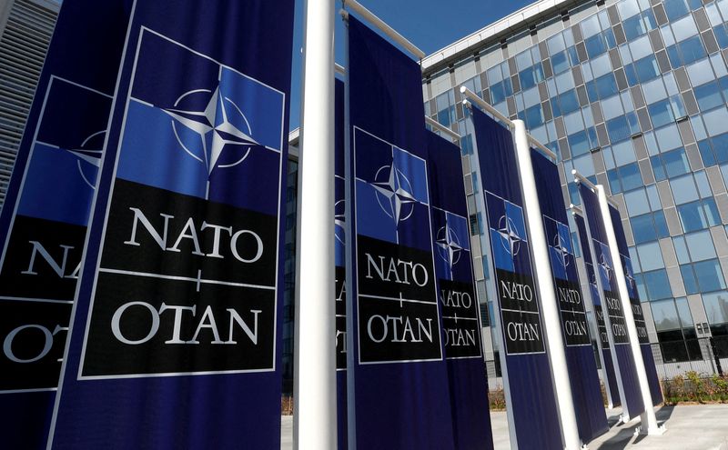 &copy; Reuters. FILE PHOTO: Banners displaying the NATO logo are placed at the entrance of new NATO headquarters during the move to the new building, in Brussels, Belgium April 19, 2018.  REUTERS/Yves Herman//File Photo